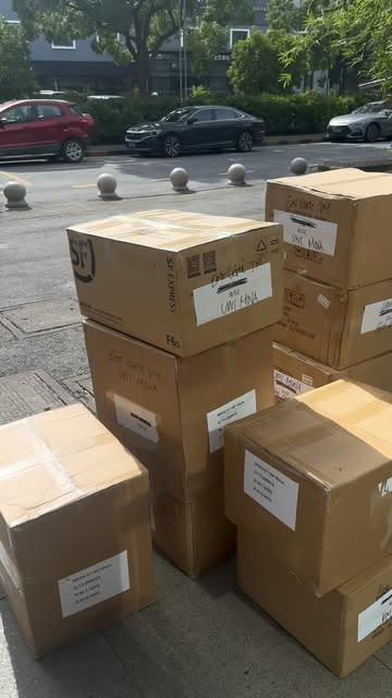 Cartons of custom merchandise labelled for UWI Mona, collected in China